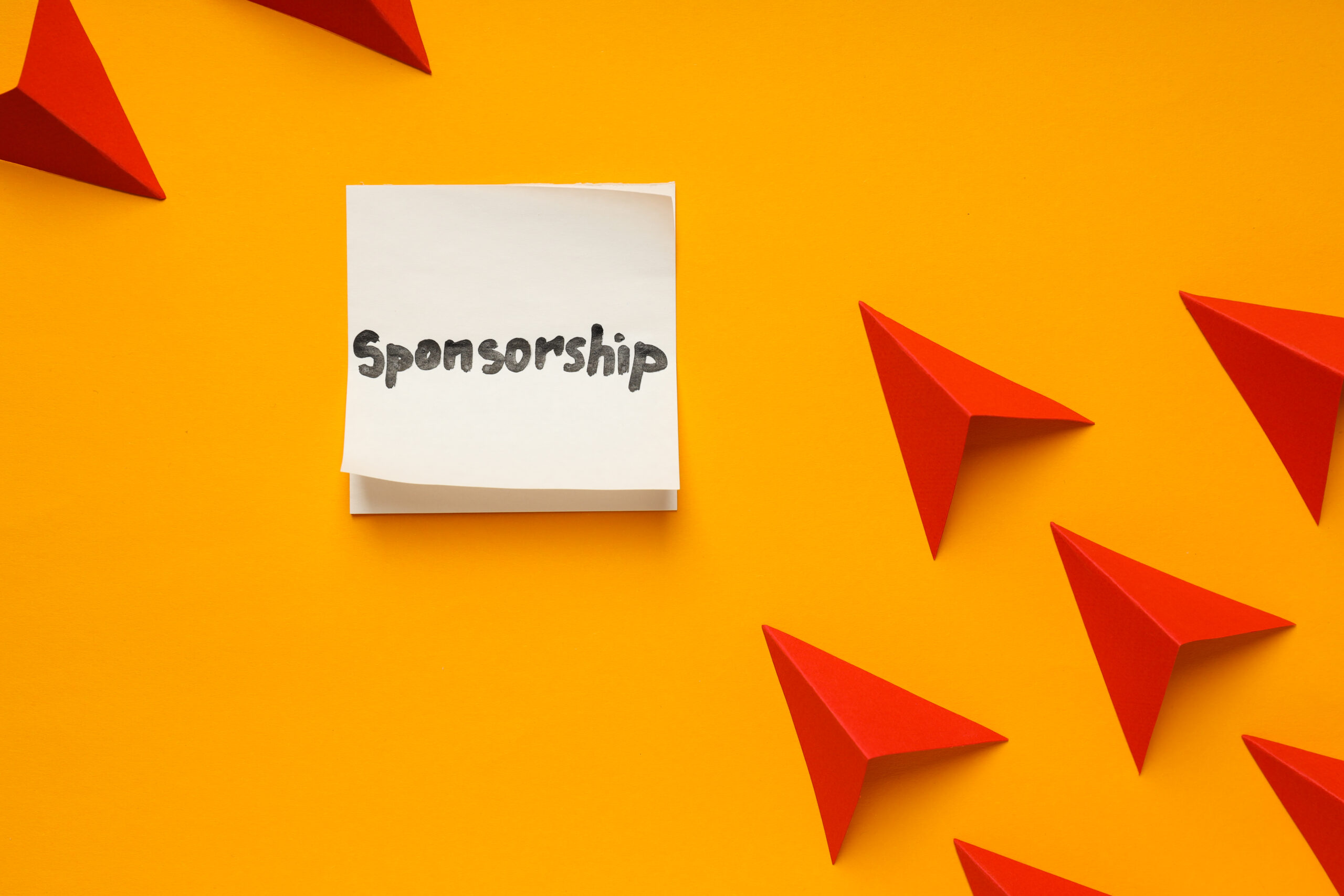 Concept of sponsorship with paper planes on yellow background